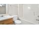 A bathroom with a shower-tub combo, vanity with light wood cabinetry, and neutral-colored walls at 3116 Fields Dr, Lithonia, GA 30038