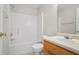 Clean bathroom featuring a tub and shower, vanity with sink, and toilet at 3116 Fields Dr, Lithonia, GA 30038