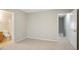 Carpeted bedroom offering access to both an en-suite bathroom and another level of the home at 3116 Fields Dr, Lithonia, GA 30038