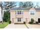 Inviting exterior elevation of a two-story home with a manicured front yard and a large front window at 3116 Fields Dr, Lithonia, GA 30038