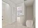 Upstairs hallway with white doors, carpet, and access to the attic and other rooms at 3116 Fields Dr, Lithonia, GA 30038