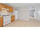 Bright kitchen showcases neutral countertops, traditional wooden cabinetry, and essential appliances, offering functional cooking space at 3116 Fields Dr, Lithonia, GA 30038