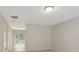 Spacious living room featuring carpeted floors, neutral paint, and sliding glass door that allows plenty of natural light at 3116 Fields Dr, Lithonia, GA 30038