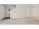 This spacious living room boasts plush carpeting and neutral paint colors that create a soothing atmosphere for relaxation and entertainment at 3116 Fields Dr, Lithonia, GA 30038