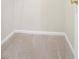 Neutral walk-in closet offers essential storage space with carpeted floor and built-in shelving at 3116 Fields Dr, Lithonia, GA 30038