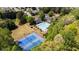 Aerial view of community pool, tennis courts, and playground surrounded by lush landscaping in a desirable neighborhood at 3806 Carriage House Dr, Cumming, GA 30040