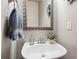 Elegant bathroom sink with stylish fixtures, decorative mirror, and tasteful decor at 3806 Carriage House Dr, Cumming, GA 30040