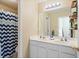 Bathroom featuring a double vanity, walk-in shower, and stylish decor at 3806 Carriage House Dr, Cumming, GA 30040