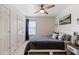 Bedroom featuring a ceiling fan, window, closet, and stylish decor at 3806 Carriage House Dr, Cumming, GA 30040