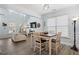Dining area with a vaulted ceiling, adjacent to a living area, perfect for Gathering gatherings and entertaining guests at 3806 Carriage House Dr, Cumming, GA 30040