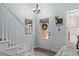 Welcoming entryway with staircase and decorative front door with sidelights at 3806 Carriage House Dr, Cumming, GA 30040