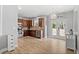 Bright kitchen with stainless steel appliances, wooden cabinetry, and direct access to the backyard at 3806 Carriage House Dr, Cumming, GA 30040
