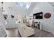 Sun-lit living room with soaring ceilings, large windows, modern furnishings, and stylish decor at 3806 Carriage House Dr, Cumming, GA 30040