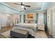 Serene primary bedroom suite with tray ceiling, ensuite bath and picture window at 3806 Carriage House Dr, Cumming, GA 30040