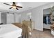 Bedroom features neutral paint, closet with sliding doors, and ceiling fan at 925 Crab Orchard Dr, Roswell, GA 30076