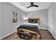 Bedroom with gray walls and wood bedframe at 925 Crab Orchard Dr, Roswell, GA 30076