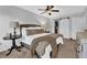 Bright bedroom with ceiling fan, a closet with sliding door and neutral earth tone decor at 925 Crab Orchard Dr, Roswell, GA 30076
