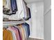 Organized walk-in closet with ample hanging space and storage for clothing and accessories at 925 Crab Orchard Dr, Roswell, GA 30076