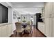 Cozy dining area featuring hardwood floors, a modern wine cooler, and elegant cabinetry at 925 Crab Orchard Dr, Roswell, GA 30076