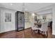 Bright dining area with modern lighting, wine cooler, and seamless flow to the kitchen at 925 Crab Orchard Dr, Roswell, GA 30076