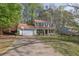 Charming two-story home with a welcoming front porch and well-maintained lawn at 925 Crab Orchard Dr, Roswell, GA 30076