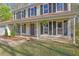 Inviting home exterior showcasing a cozy porch adorned with hanging plants and charming details at 925 Crab Orchard Dr, Roswell, GA 30076