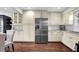 Spacious kitchen features stainless steel refrigerator, cabinets and granite countertops at 925 Crab Orchard Dr, Roswell, GA 30076