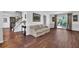 Expansive living room with hardwood floors, neutral decor, and large windows for ample light at 925 Crab Orchard Dr, Roswell, GA 30076