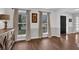 Bright living room features hardwood floors, large windows, and neutral paint colors at 925 Crab Orchard Dr, Roswell, GA 30076