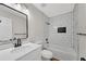 This bathroom features modern fixtures, a white vanity and a subway-tiled tub with a shower at 111 Shenandoah Ct, Hiram, GA 30141