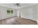 Spacious bedroom with tray ceiling, ceiling fan, and large window at 111 Shenandoah Ct, Hiram, GA 30141
