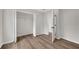 The bedroom includes two closets, wood-look flooring, neutral paint and doorways to other rooms at 111 Shenandoah Ct, Hiram, GA 30141