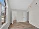 This bedroom includes wood-look flooring, neutral paint, vaulted ceilings, and a view into two closets at 111 Shenandoah Ct, Hiram, GA 30141
