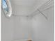 The closet includes wire shelving, neutral paint and a small window providing natural light at 111 Shenandoah Ct, Hiram, GA 30141