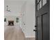 Inviting foyer with wood-look flooring and views of the living room and fireplace at 111 Shenandoah Ct, Hiram, GA 30141