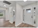 Light-filled foyer featuring wood floors, front door with window, and access to bath at 111 Shenandoah Ct, Hiram, GA 30141