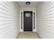 Charming front door with sidelights and a transom window offering a bright and inviting entrance at 111 Shenandoah Ct, Hiram, GA 30141