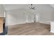 Bright open-plan living area with vaulted ceiling, fireplace and wood look flooring at 111 Shenandoah Ct, Hiram, GA 30141