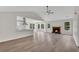 Spacious living room with a fireplace, vaulted ceilings, and lots of natural light at 111 Shenandoah Ct, Hiram, GA 30141