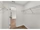 Walk-in closet with wood floors, metal shelving, and open access to bedroom at 111 Shenandoah Ct, Hiram, GA 30141