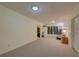 Spacious finished basement featuring neutral carpeting, ample lighting and a separate storage space at 1658 Lightfoot Cir, Marietta, GA 30062