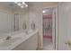 Bathroom with dual sink vanity, mirror, and a shower with curtain at 1658 Lightfoot Cir, Marietta, GA 30062