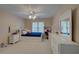 Bright bedroom features neutral tones, carpet, ceiling fan and natural light at 1658 Lightfoot Cir, Marietta, GA 30062