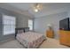 Bedroom with blue walls, carpet, a ceiling fan and lots of natural light at 1658 Lightfoot Cir, Marietta, GA 30062