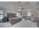 This main bedroom features a tray ceiling, ceiling fan and plenty of space at 1658 Lightfoot Cir, Marietta, GA 30062