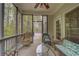 Inviting screened-in porch with wicker seating, providing an ideal spot for outdoor relaxation at 1658 Lightfoot Cir, Marietta, GA 30062