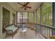 Relaxing screened porch with comfortable wicker furniture offering a serene outdoor living space at 1658 Lightfoot Cir, Marietta, GA 30062