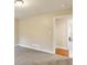 Neutral bedroom with plush carpeting, a window, and white trim, offering a calming space at 645 Trailmore Pl, Roswell, GA 30076