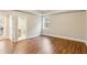 Bright bedroom features wood floors, window and an ensuite bathroom at 645 Trailmore Pl, Roswell, GA 30076