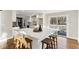 Bright kitchen features a center island with barstool seating and sliding glass doors to outdoor deck at 645 Trailmore Pl, Roswell, GA 30076